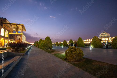 Aali Qapu Palace AND Sheikh Lotfollah Mosque Together (Wide View) Under Purple Sky Shining Due To The Lights At Night In Shah (Imam) Square In Isfahan Iran photo