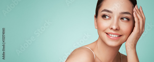 Portrait beautiful young woman with clean fresh skin. Model with healthy skin, close up portrait. Cosmetology, beauty and spa photo