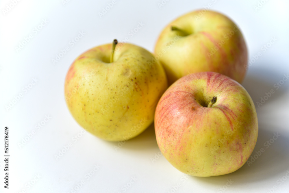 Yellow-red apples on a white background