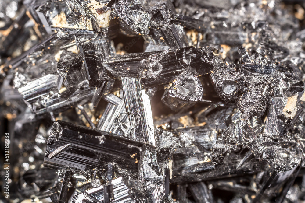 Tourmaline black crystals. Gems. Mineral crystals in the natural environment. Texture of precious and semiprecious stones. Seamless background with copy space colored shiny surface of precious stones. Tourmaline black crystals. Gems. Mineral crystals in the natural environment. Texture of precious and semiprecious stones. Seamless background with copy space colored shiny surface of precious stones.
