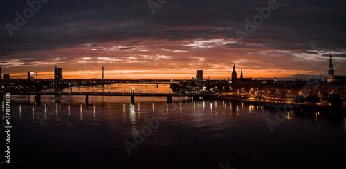 Beautiful aerial view of the sunset over Riga city old town in Latvia. Sunset over Riga. © Aerial Film Studio