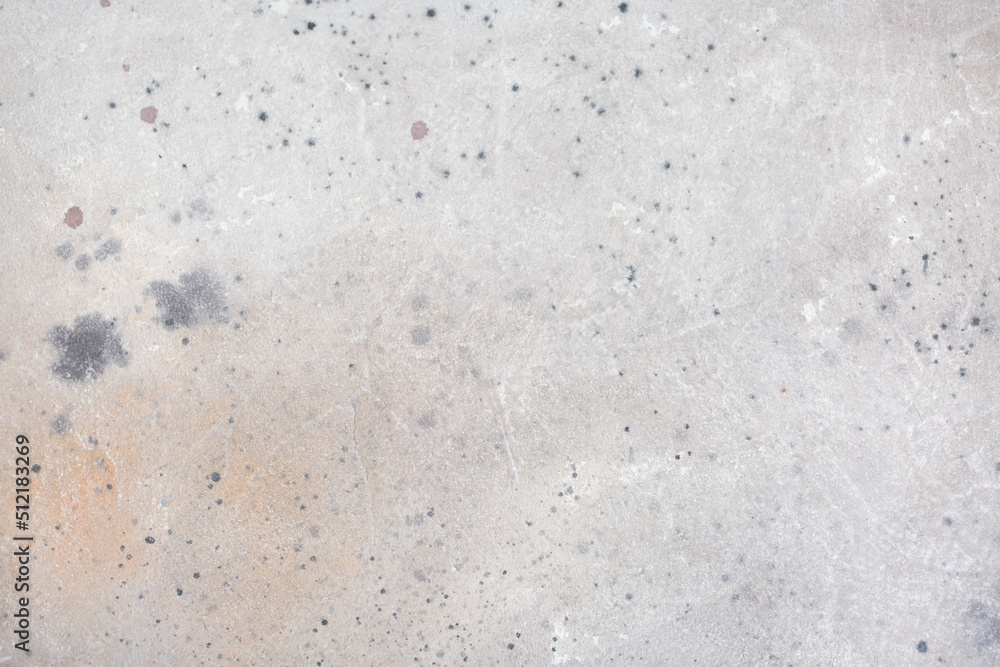 Light background of decorative plaster with abstract spots. Unusual texture of white or gray wall with beautiful patterns, creative surface background. Finishing coating for building cladding.