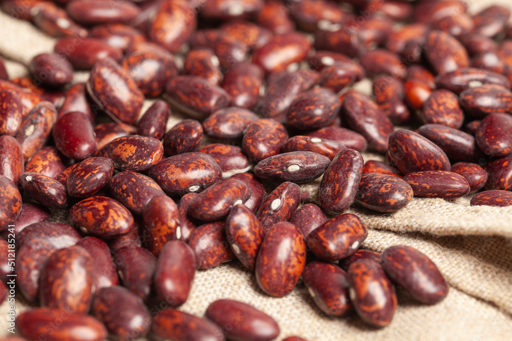 Grains red beans putting on linen background Grains red beans putting on linen background