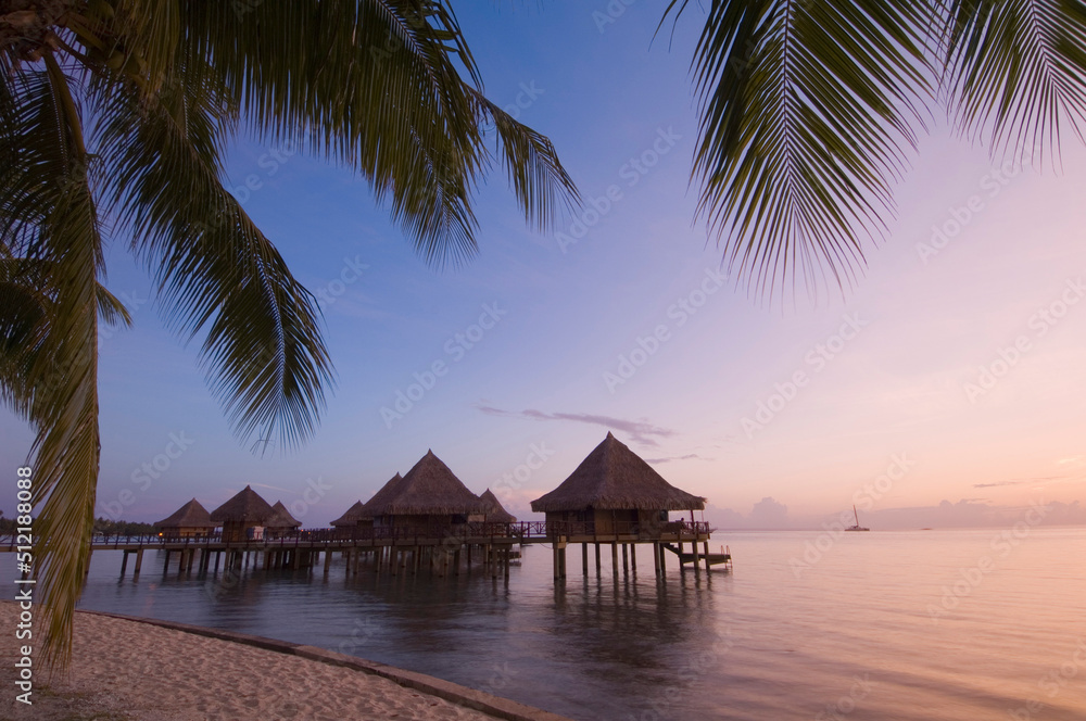 Stilt houses at a tourist resort on the beach, Hotel Kia Ora, Rangiroa, Tuamotu Archipelago, French Polynesia Stilt houses at a tourist resort on the beach, Hotel Kia Ora, Rangiroa, Tuamotu Archipelago, French Polynesia