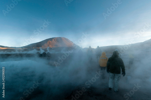 Chile, Atacama Desert, El Tatio Geysers, People in geyser steam photo