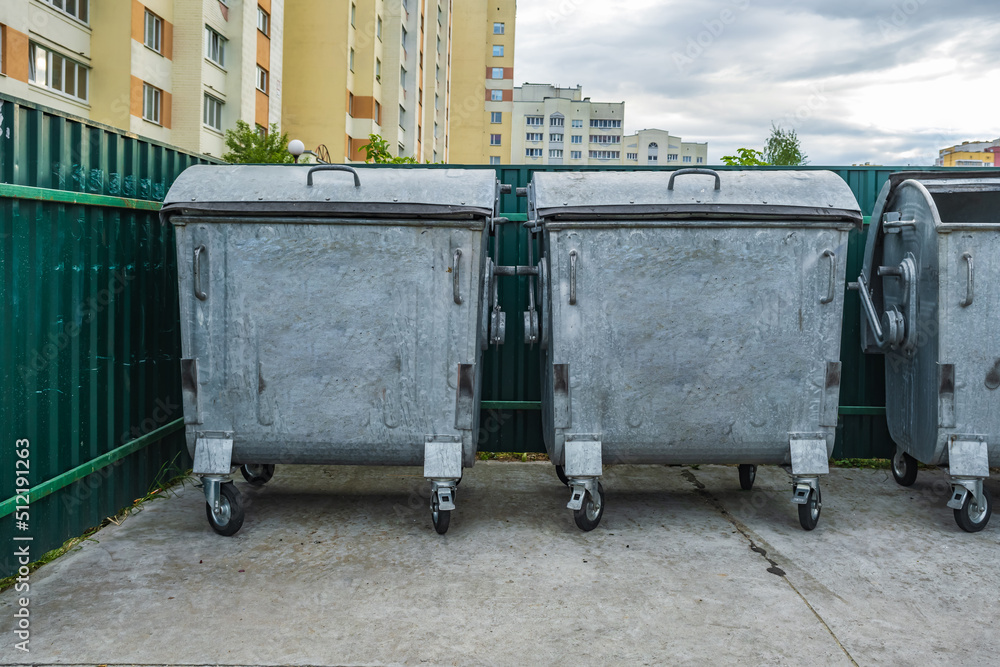 metal trash cans for separate waste collection in a densely populated area of the city metal trash cans for separate waste collection in a densely populated area of the city