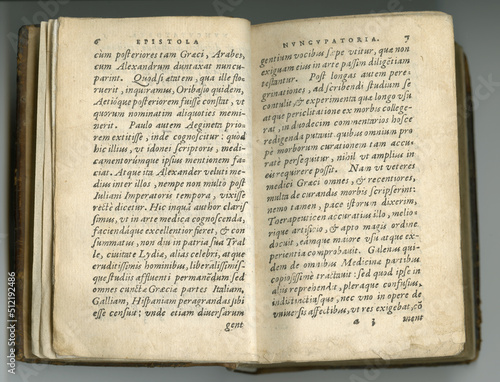 Fotografie Weathered old pages in Latin
