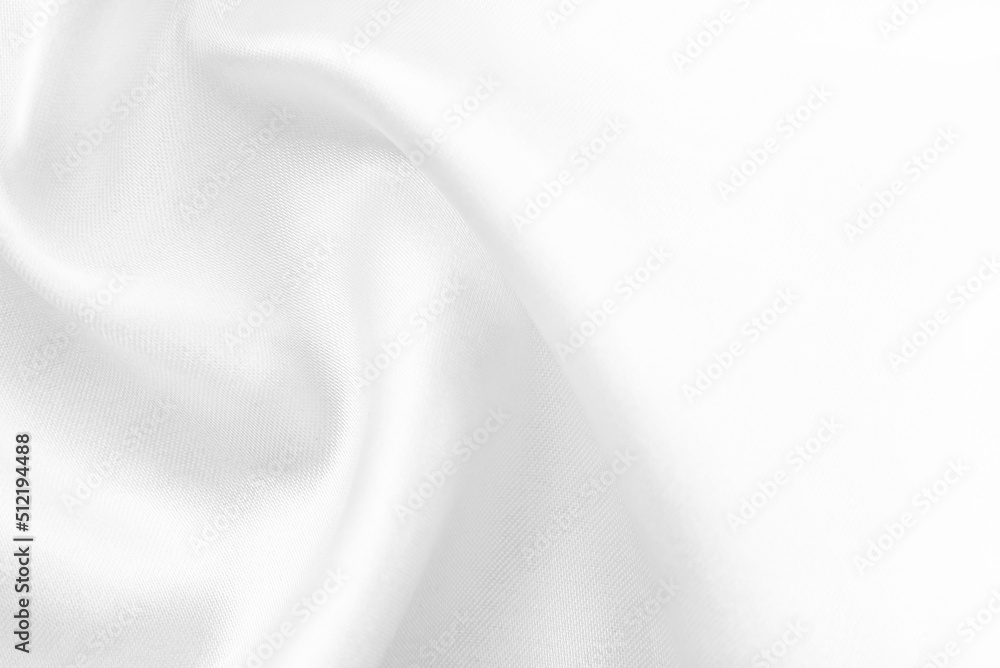 A twisted piece of white fabric. White material or texture with waves and folds. Wrinkled white fabric A twisted piece of white fabric. White material or texture with waves and folds. Wrinkled white fabric