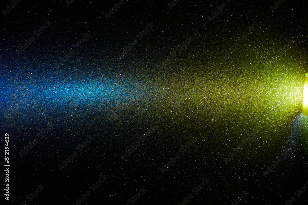 Obraz premium Yellow and blue transitional gradient light beam on black background