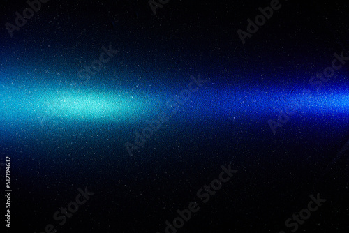 On a black smooth background, a blue gradient horizontal beam of light