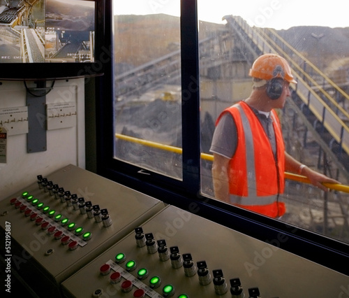 Man walking past control room in quarry