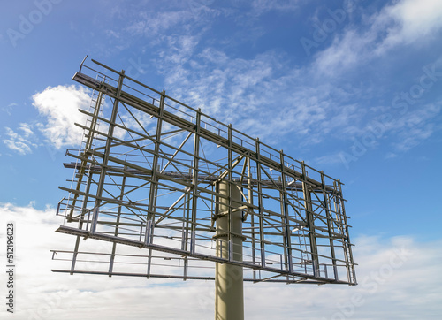 Raised billboard frame against blue sky photo