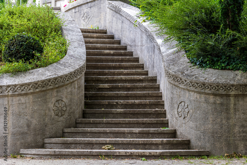 Beautiful stairs of the pergola complex in Tullnaupark Nuremberg. This stone staircase is surrounded by beautiful summer planting. 