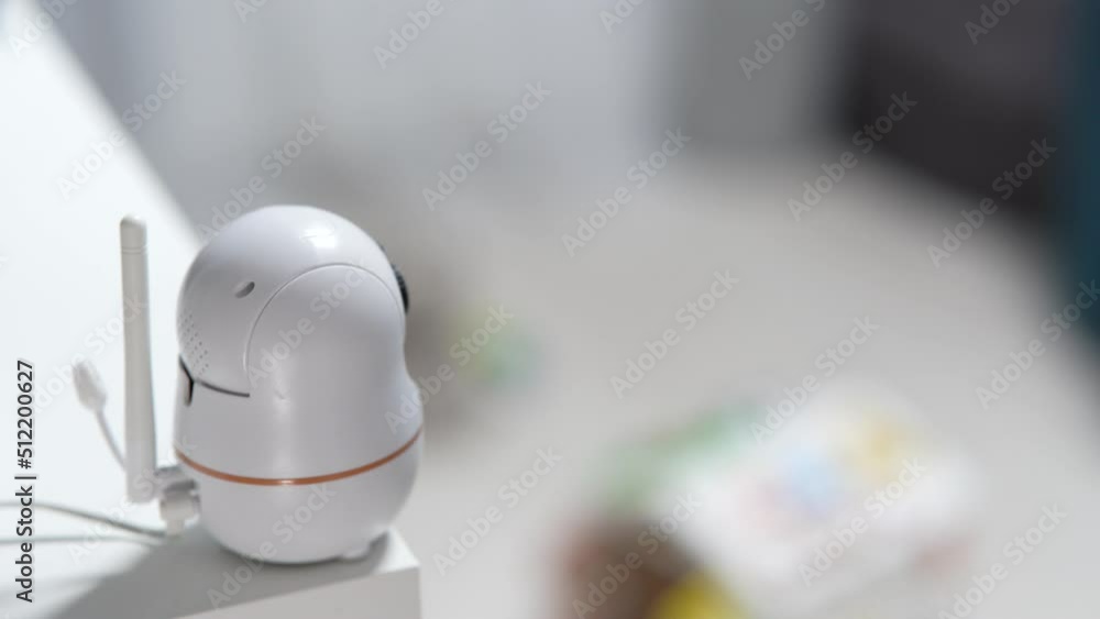 The baby monitor camera with the rotation function monitors the child in the room The baby monitor camera with the rotation function monitors the child in the room