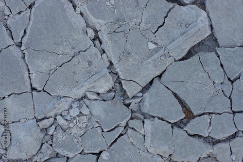 texture of gray pieces of stones with cracks on the ground  © butus