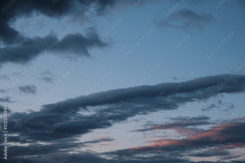 Fototapeta premium Thunderstorm dramatic clouds during evening sunset.