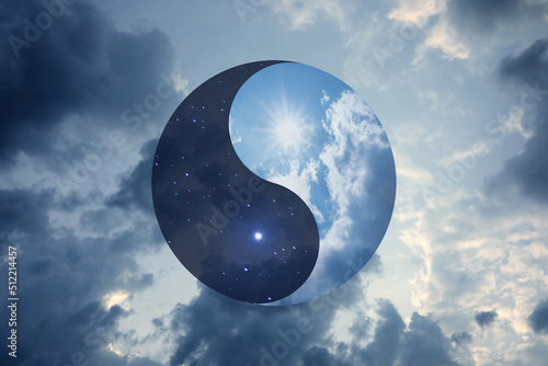 Ying Yang symbol against cloudy sky. Feng Shui philosophy