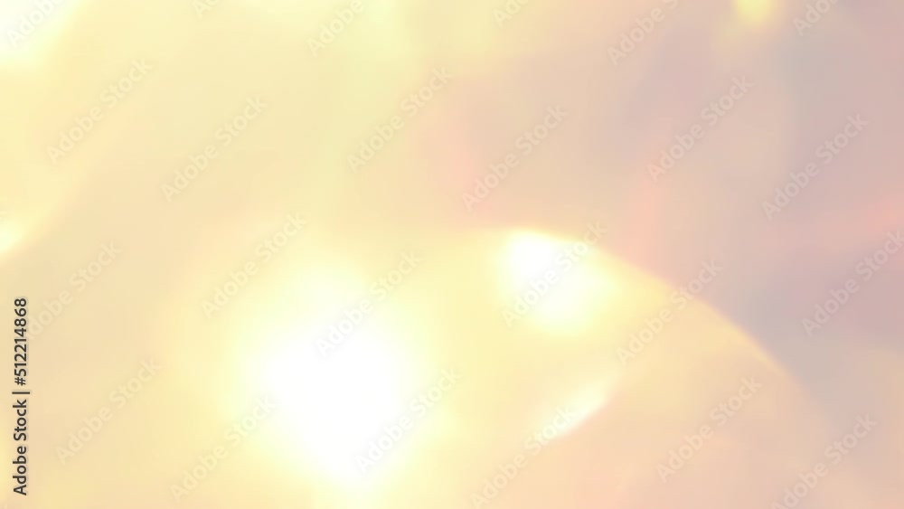 Rose Gold Bokeh with Light Leaks Movement. Abstract moving background. Large moving bokeh with bright sunbeams and light reflections randomly move. Multi-layer Lens flare effect.