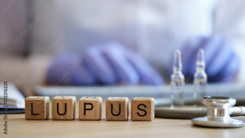Word lupus collected of wooden cubes in raw
