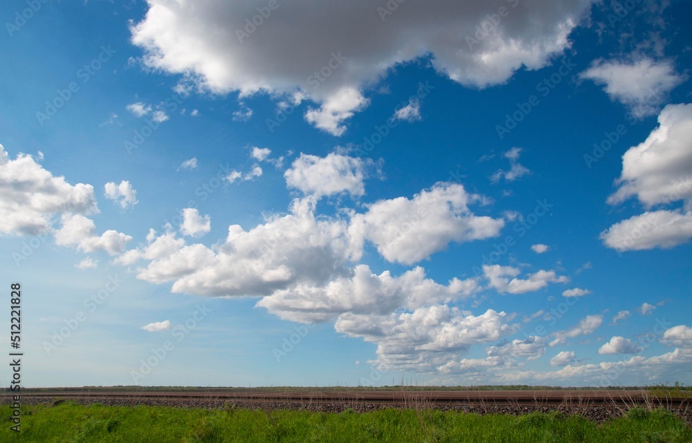 Naklejka premium Summer sky and the track 1