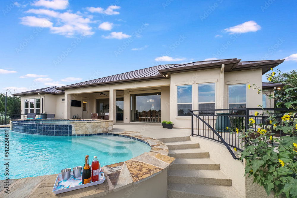 A luxury home pool on a sunny day A luxury home pool on a sunny day