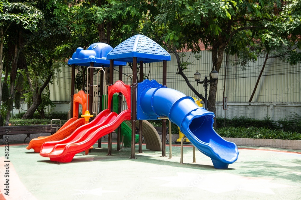 Colorful playground made of plastic empty outdoor playground set playground equipment.  Play area. Garden equipment. Children's slide. Playground in the park..