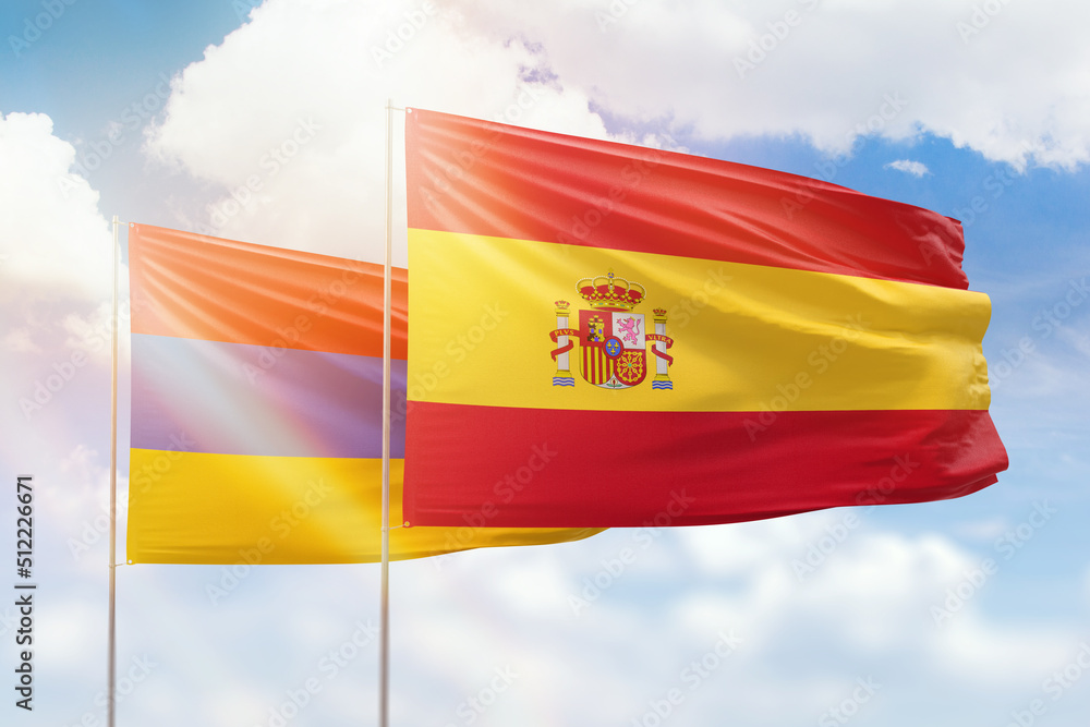 Sunny blue sky and flags of spain and armenia Sunny blue sky and flags of spain and armenia
