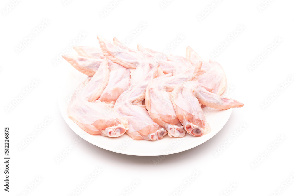 Raw chicken wing in white dish isolated on white Raw chicken wing in white dish isolated on white