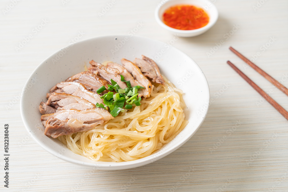 dried noodles with stewed duck in white bowl