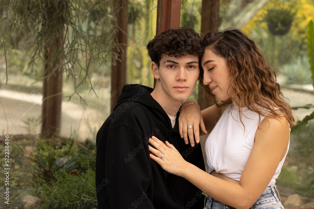 Young Latino model couple from Costa Rica on a winter day. Looking at each other and caressing each other. Young Latino model couple from Costa Rica on a winter day. Looking at each other and caressing each other.