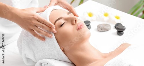 Young woman having facial m...