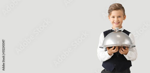 Cute little waiter on light...