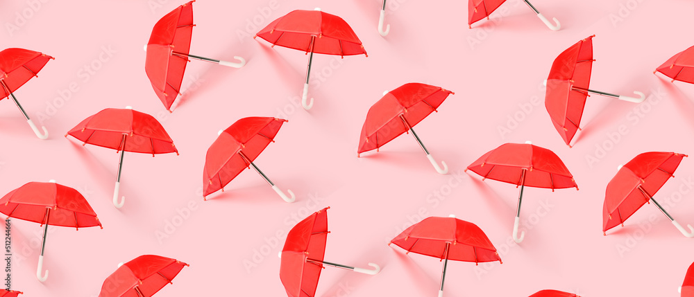 Many red umbrellas on pink background. Pattern for design - obrazy, fototapety, plakaty 