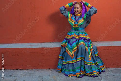 Young Mexican woman prepares her dress and makeup for a traditional Mexican dance © Elmer Hidalgo Photo