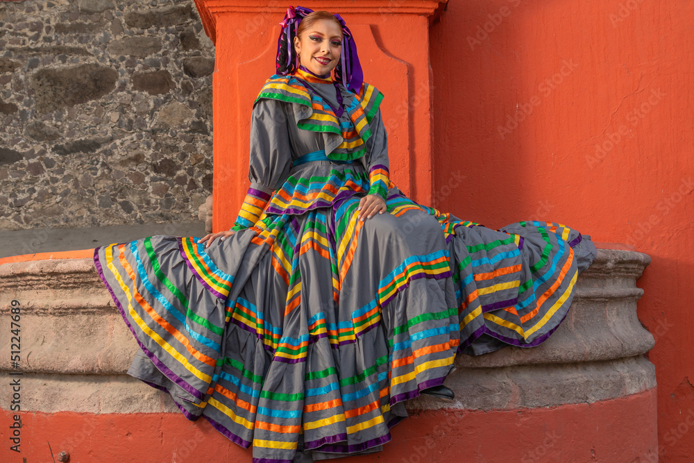 Portrait of a Mexican woman wearing a traditional dress for folk dance
