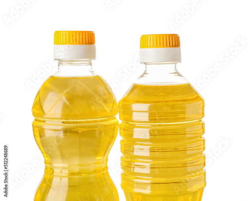 Bottles with sunflower oil on white background, closeup