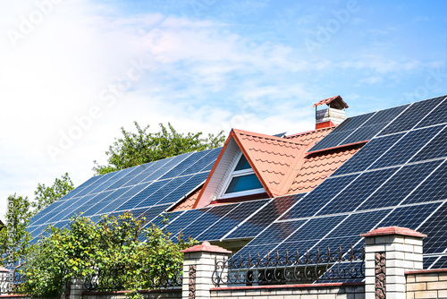 solar panels, Close up shot of a solar panel array with blue sky, Solar panels on a roof for electric power generation