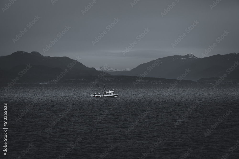Boat on the lake with mountain background