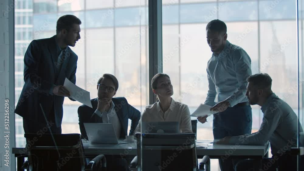 Diverse group of work colleagues talking at corporate office meeting. Business people at meeting Diverse group of work colleagues talking at corporate office meeting. Business people at meeting