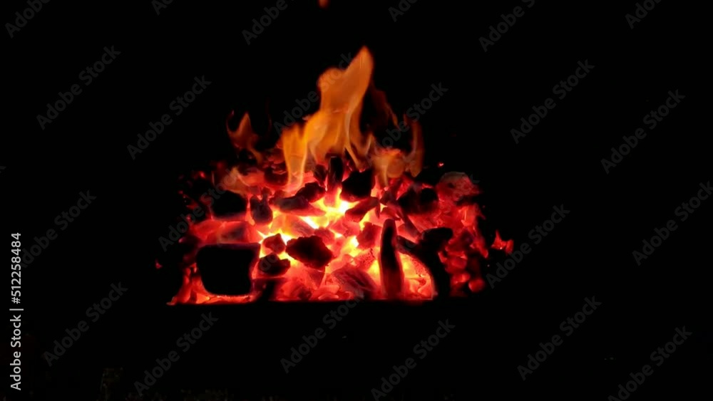 forge of a blacksmith with fire produced with charcoal to shape and forge tempered steel utensils. Shot close-up blocked. Galicia, Spain forge of a blacksmith with fire produced with charcoal to shape and forge tempered steel utensils. Shot close-up blocked. Galicia, Spain