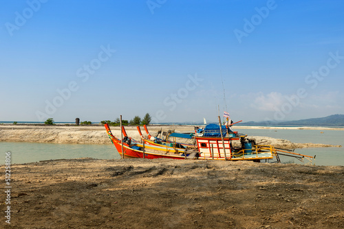 Fototapeta Naklejka Na Ścianę i Meble -  Thai style wooden fishing boats at the dead coral flats beach in Phang nga, Thailand, travel industry in south of Thailand, summer outdoor day light
