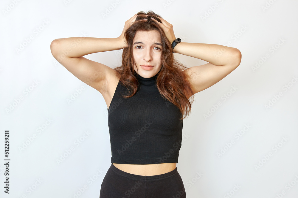 The beautiful girl took her hand to her head. Emotion of despair. The beautiful girl took her hand to her head. Emotion of despair.