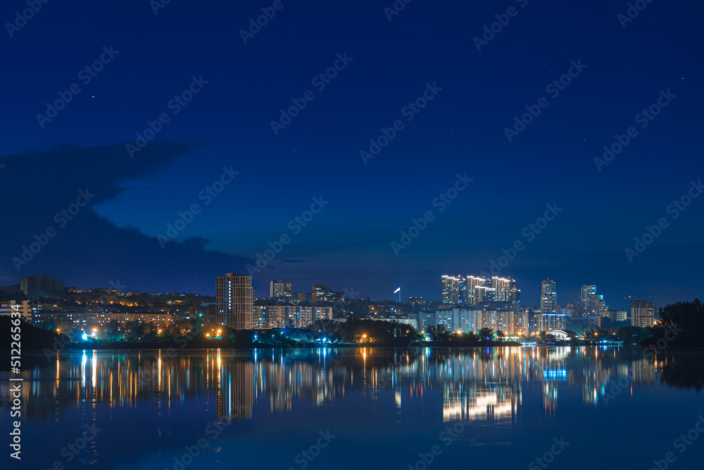 Beautiful view of the night city. Right bank of the Dnieper, lights in the night river. View of beautiful modern buildings. Beautiful view of the night city. Right bank of the Dnieper, lights in the night river. View of beautiful modern buildings.