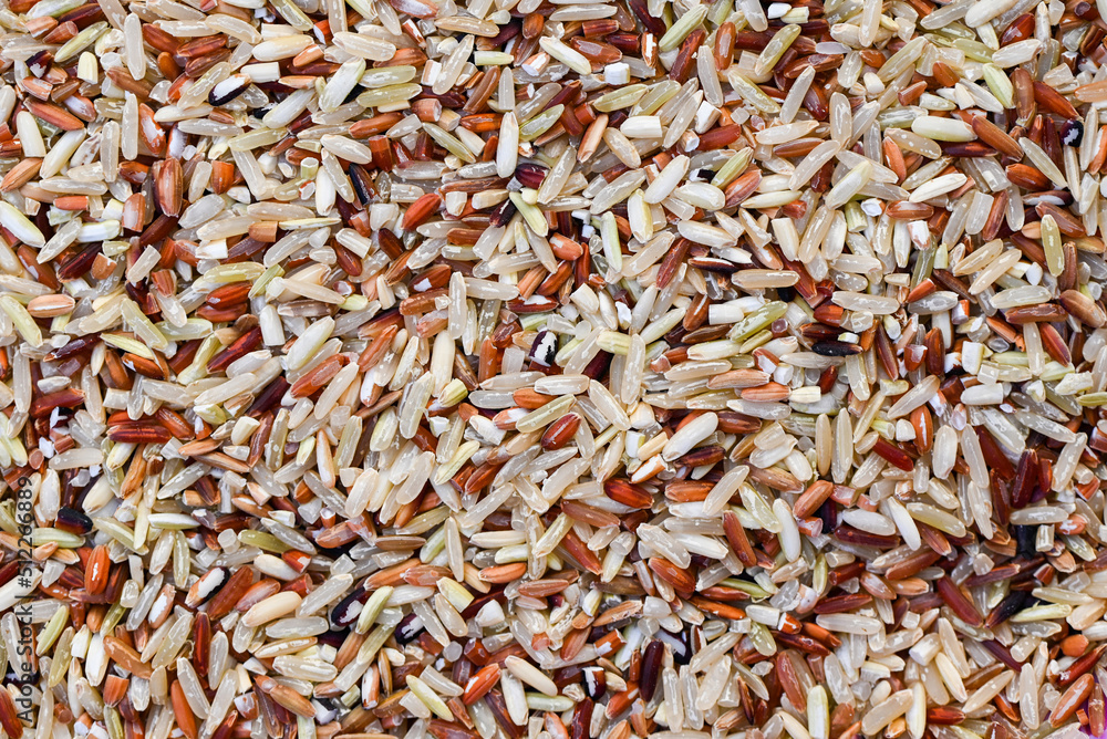 brown rice texture background , various rice color mixed thai rice for cooking food , Loonzain rice brown black red white purple health food background.