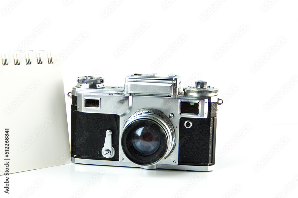 Old Soviet rangefinder analog camera top view on a white background
