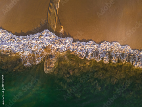 Beautiful aerial view of Costa Rica Beach Playa Rajada in Cuajiniquil Guanacaste in magical yellow sunset photo