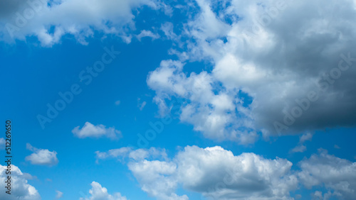 Fototapeta Naklejka Na Ścianę i Meble -  Beautiful white clouds in the blue sky. Fluffy cumulus clouds. Natural weather. Background image.
