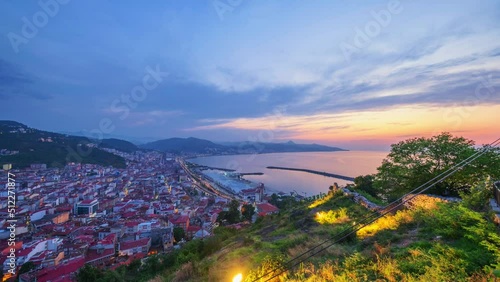 Time-lapse of city Giresun, Turkey from day to night. Sunsets over the sea. Beautiful 4K shot photo