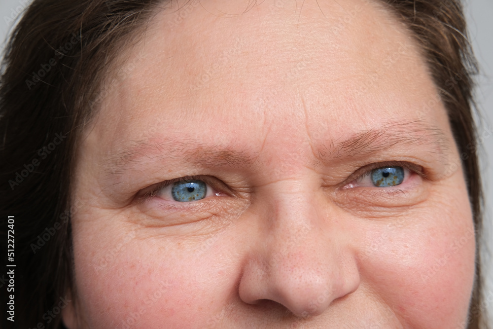 close up part of mature woman 50 years face, girl 20-29 years old, human eye, small wrinkles around eyes, overhang, concept of surveillance, vision examination, cosmetic anti-aging procedures close up part of mature woman 50 years face, girl 20-29 years old, human eye, small wrinkles around eyes, overhang, concept of surveillance, vision examination, cosmetic anti-aging procedures