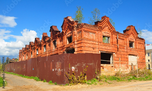 The malls are a crumbling monument of brick eclecticism. City of Kimry, Tver region, Russia photo
